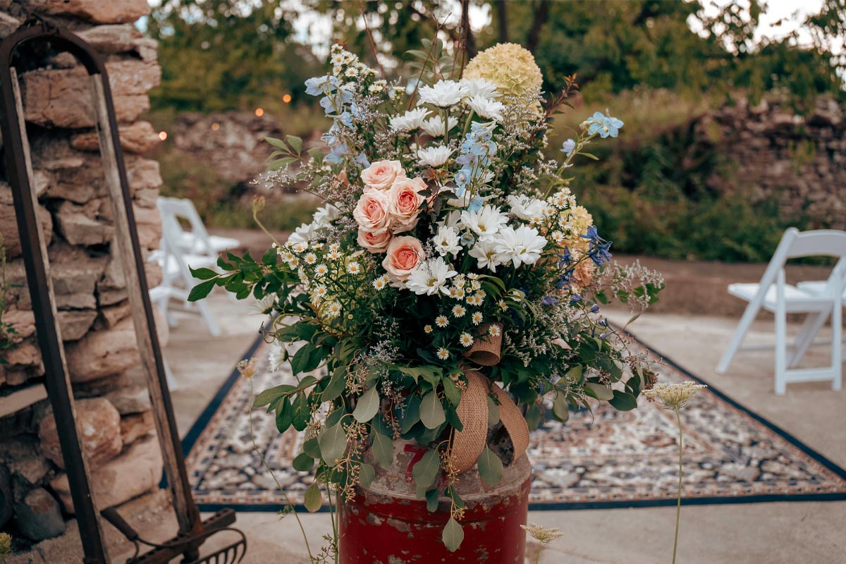 Rustic wildflower arrangement for a barn wedding centerpiece